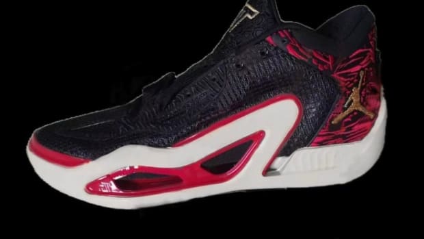 View of black, red, and white Jordan shoe.